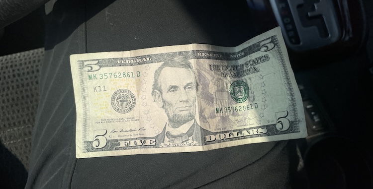 photo of five dollar bill