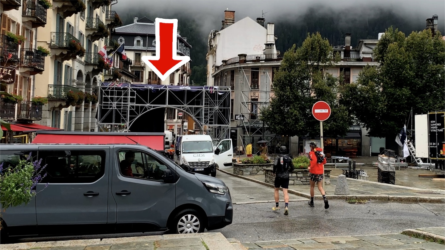 Majell and Brendan run toward the UTMB finish arch in Chamonix